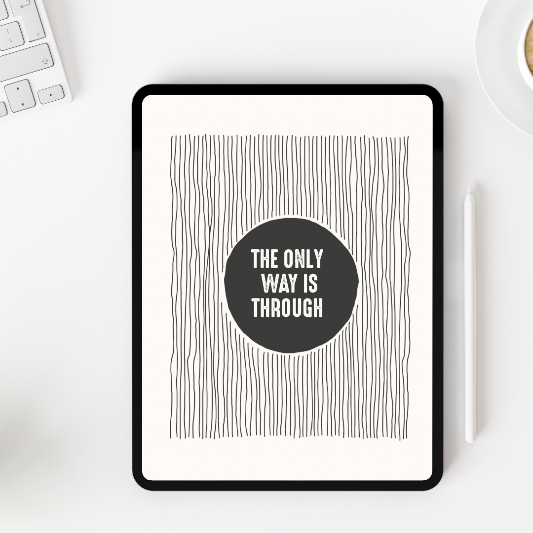 Digital tablet displaying a motivational quote on a white desk with a keyboard and mug.