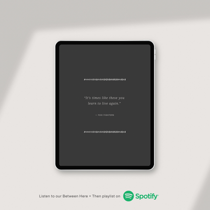 Tablet displaying a quote with Spotify logo on a light gray background
